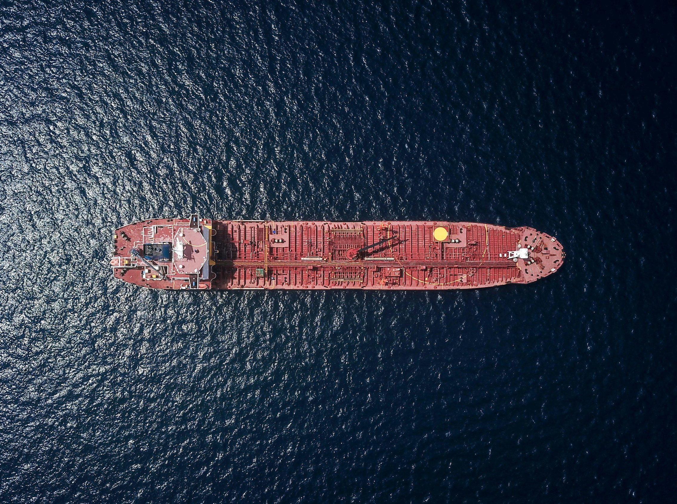 A product tanker seen from directly above on dark open water
